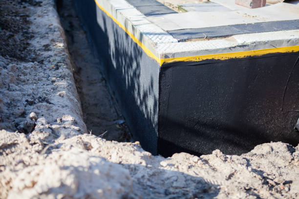 Professional Basement Waterproofing technician working in Orlinda, TN